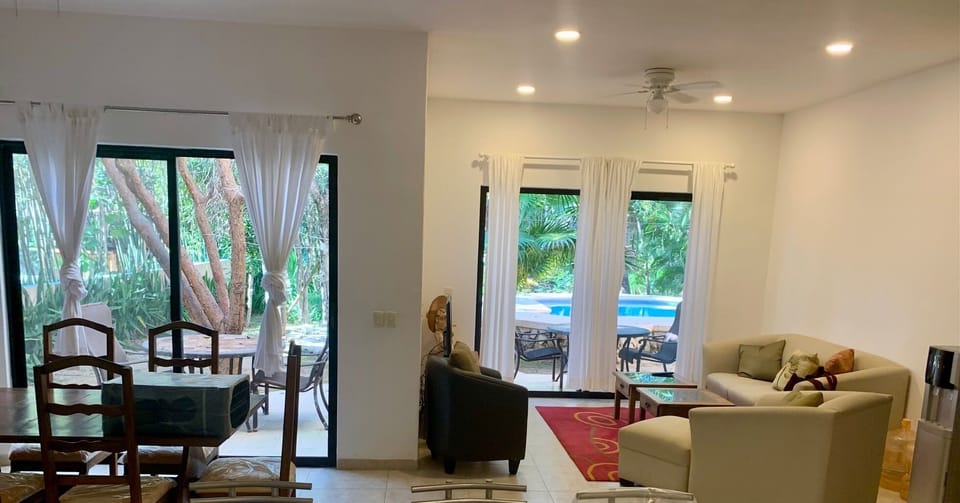 Living Room & Dinning Room overlooking pool area.
