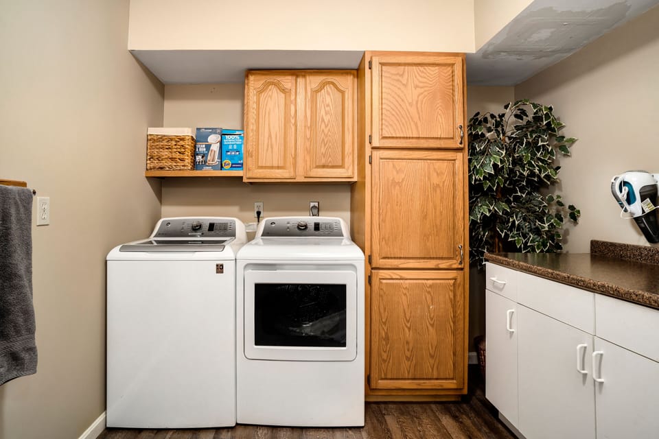 Laundry area which is located in the lower bathroom. 