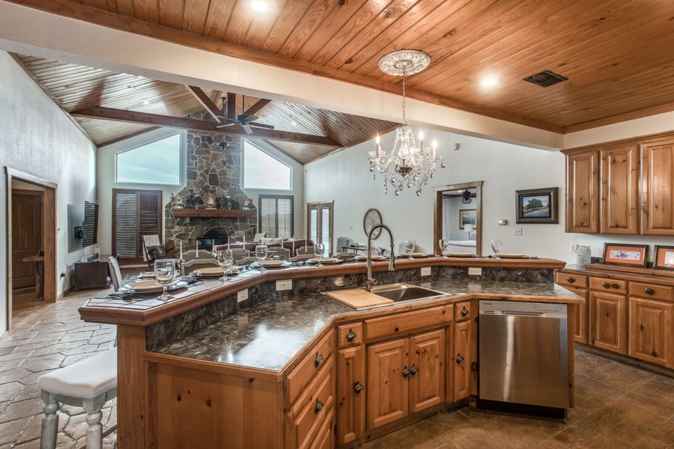 Well equipped kitchen with stainless refrigerator and modern convection oven