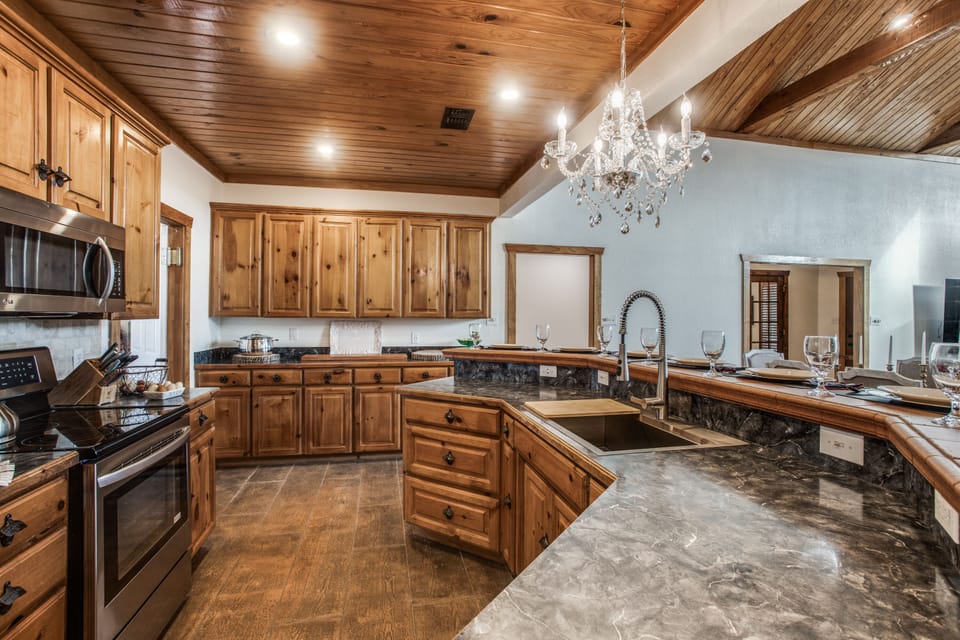 Beautiful dishes and glassware for entertaining in the cabinets