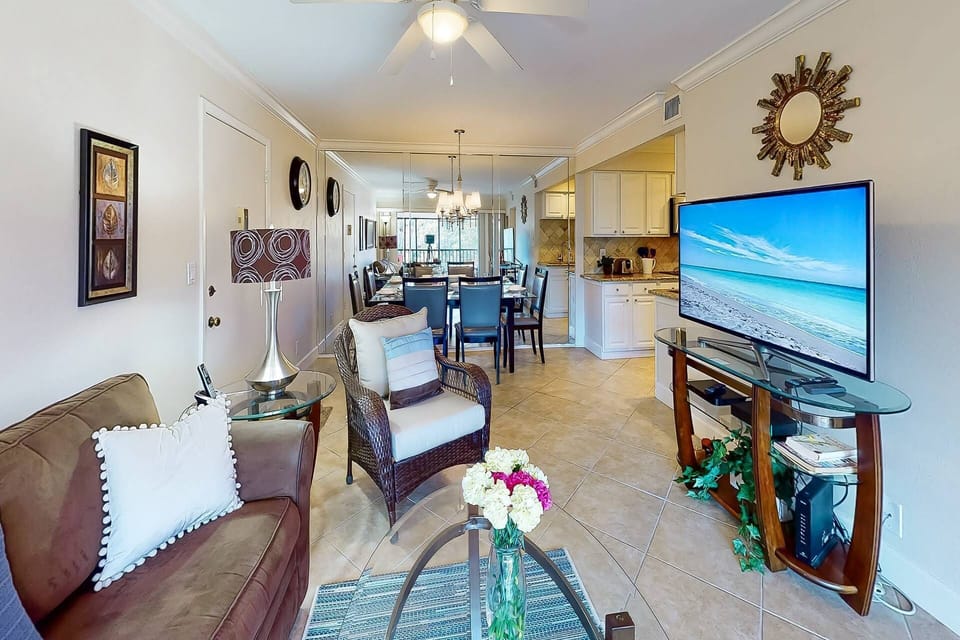 Living room is open to the dining area & kitchen.  Enjoy your favorite movies on the big screen.  Cable included and includes ability to stream.