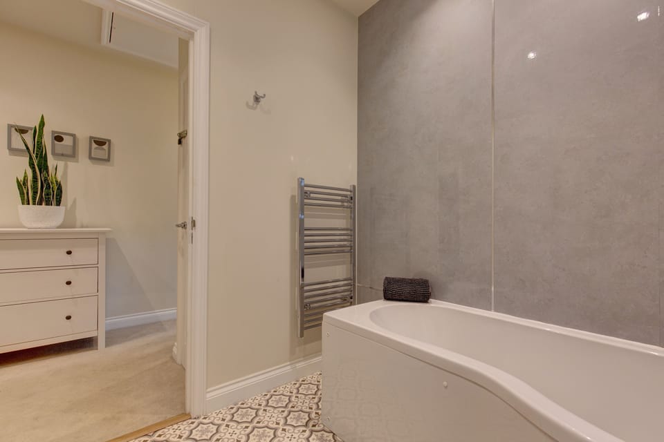First floor: Bathroom and storage area on the landing