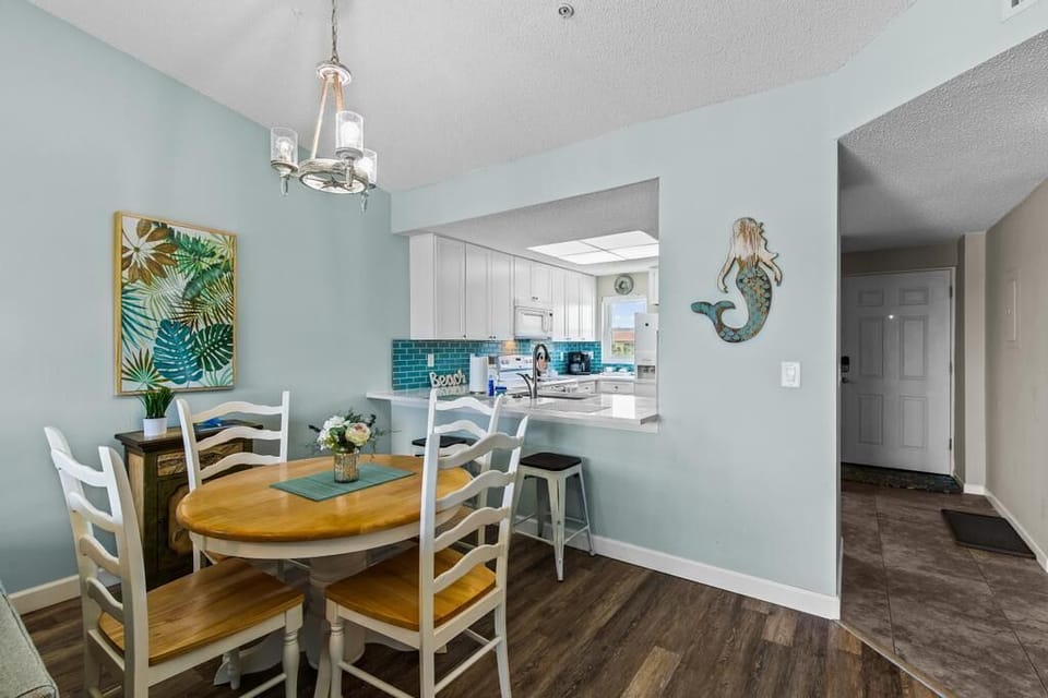 -The dining area. There are also puzzles and games in the small cabinet.