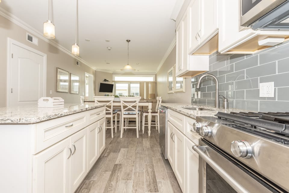 kitchen with gas stove and custom tile