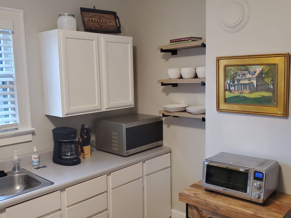 Kitchen features, microwave, toaster oven, drip coffee maker, & knife block
