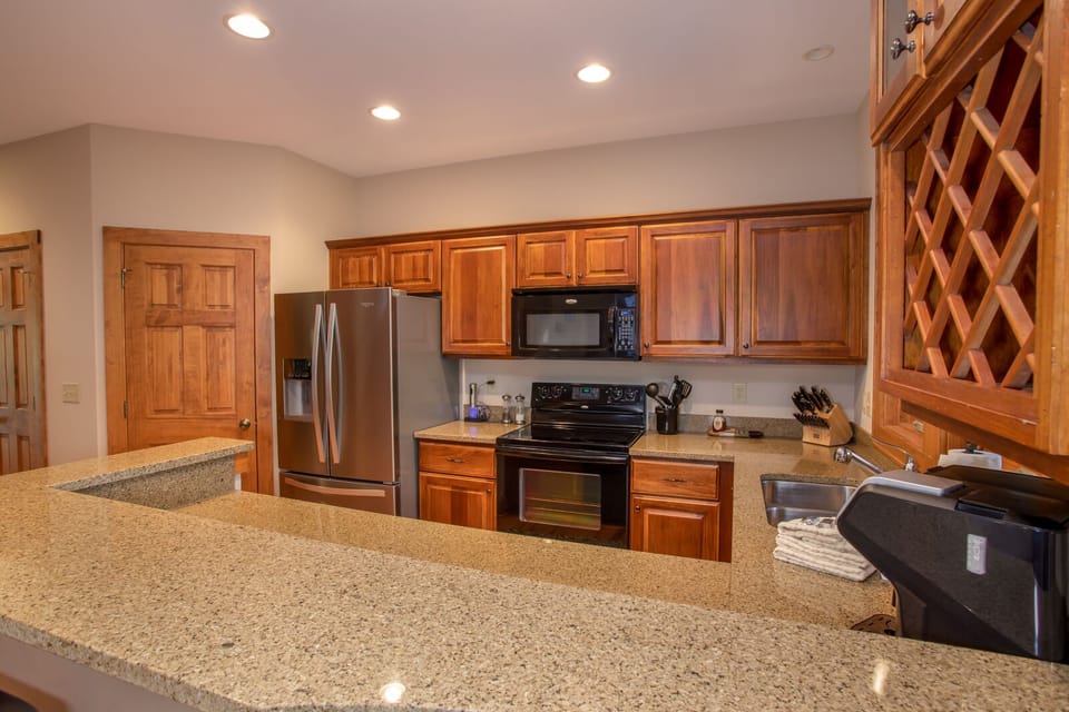 Modern Kitchen with granite counters and bar top seating