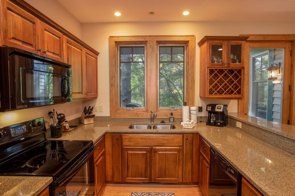 Modern Kitchen with granite counters and bar top seating