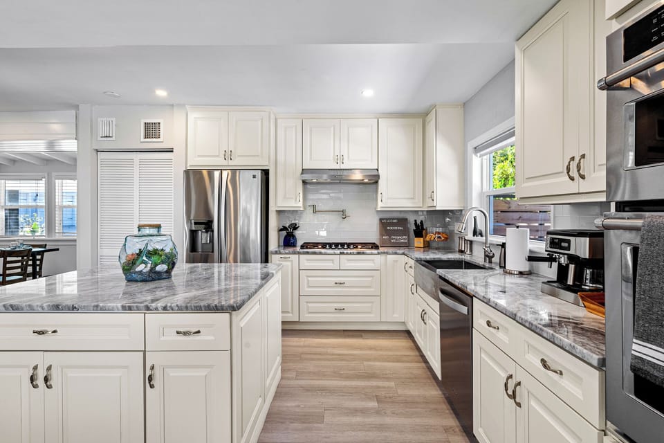 Oven / microwave stack separate from gas range and pot filler