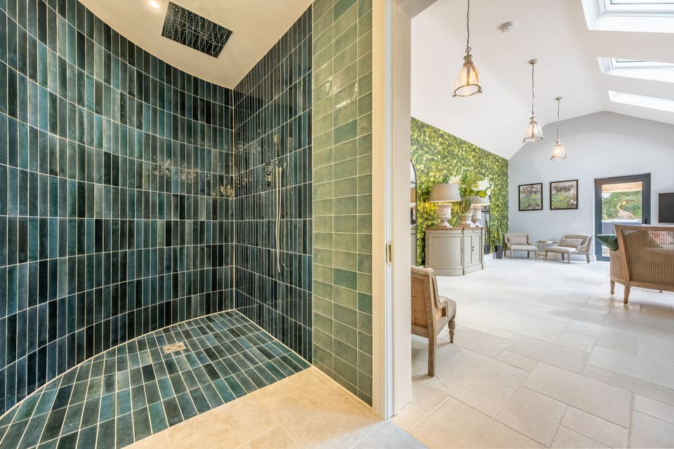 Wet room from The Greenhouse with large, curved shower