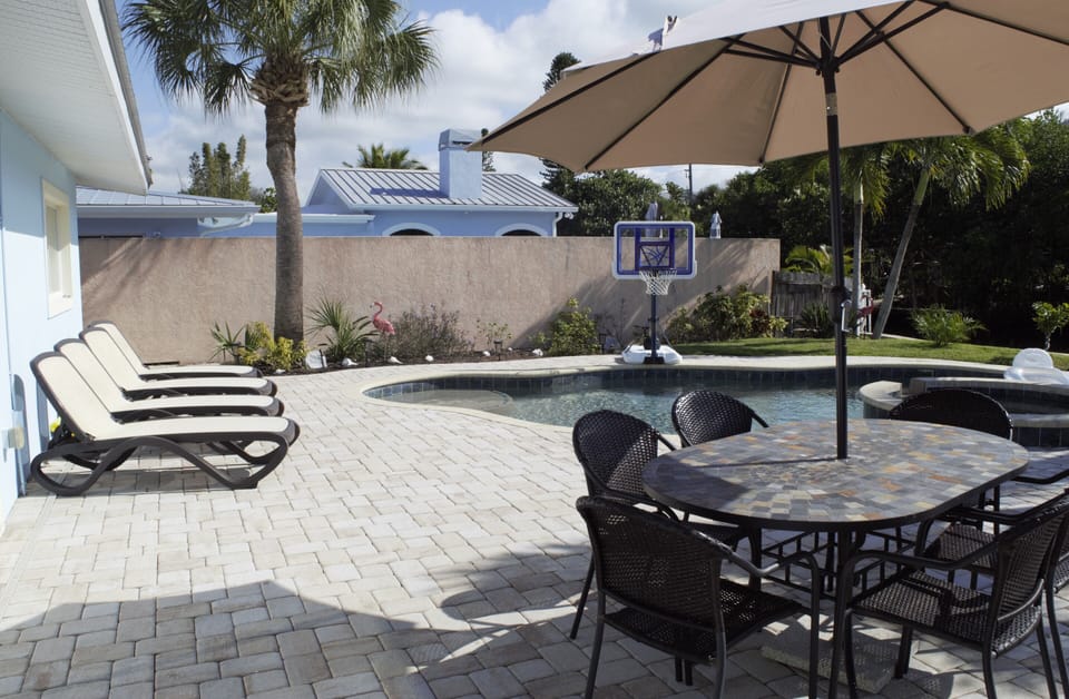 Enjoy dining by the beautiful pool.