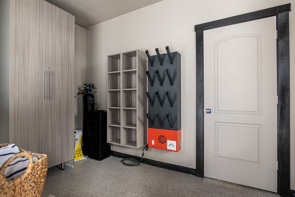 Private boot and ski storage room with boot dryers