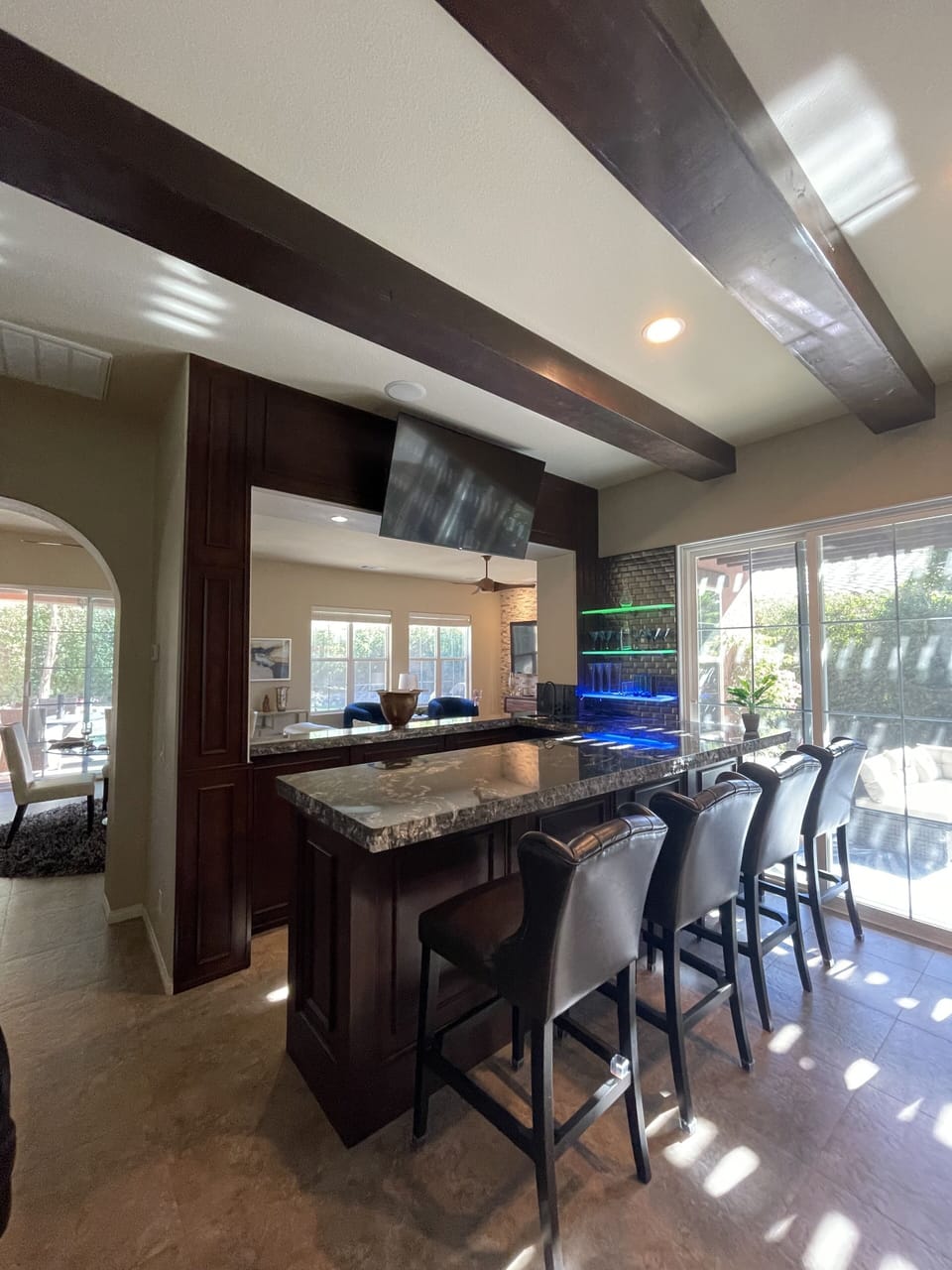 Bar with lots of seating and large television