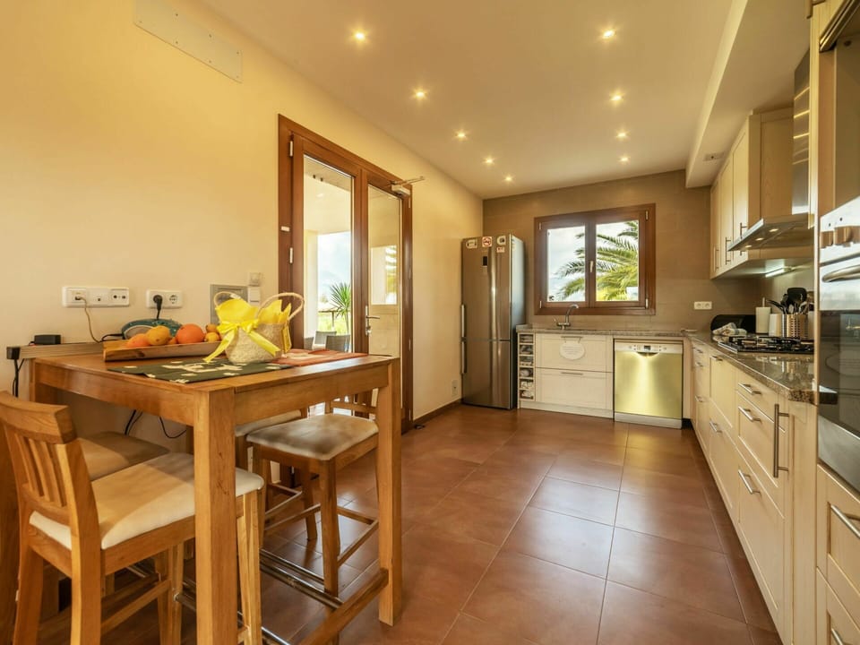 Cabinetry, Furniture, Property, Table, Countertop, Wood, Chair, Interior Design, Drawer, Kitchen Stove