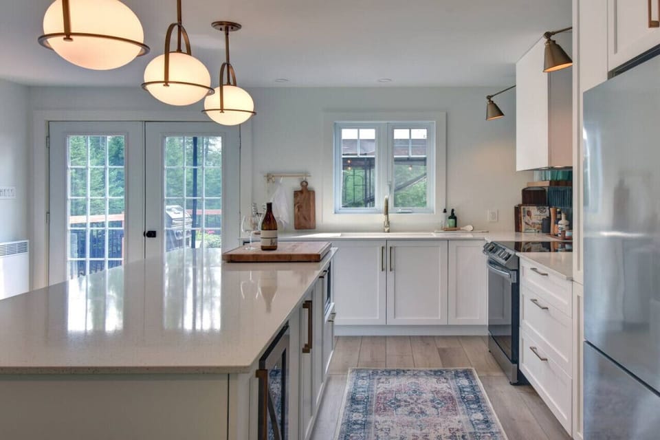 Sleek white countertops—offering a clean, modern workspace in the kitchen.