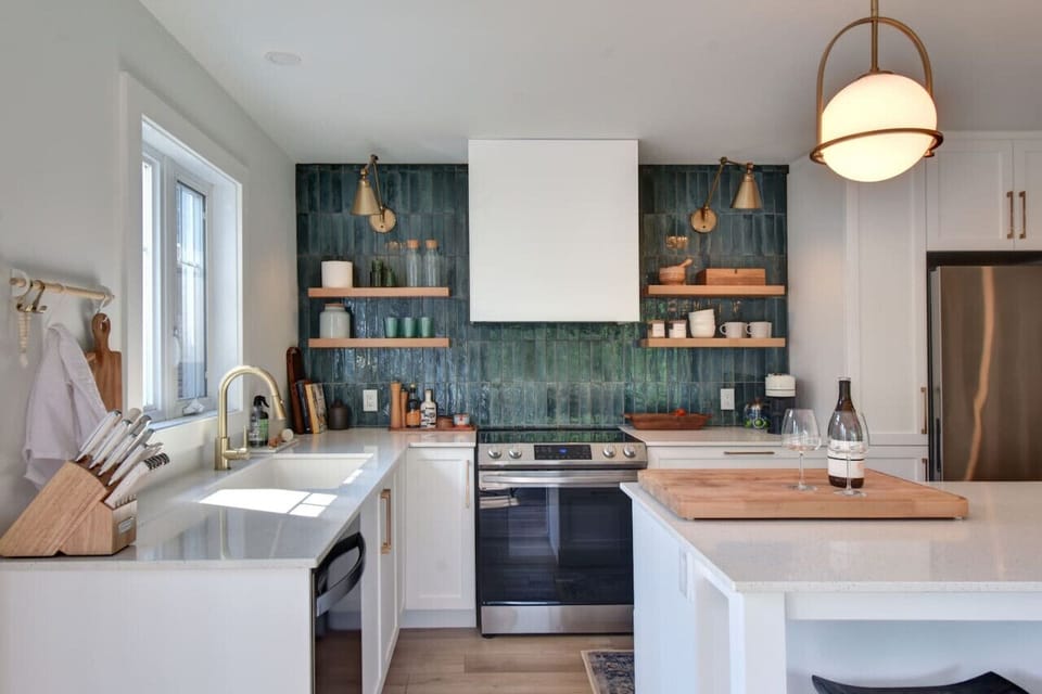 Well-organized kitchen with a modern white and wood theme—blending style and functionality for a seamless cooking experience.