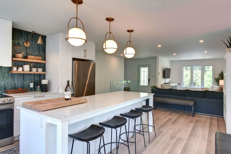 Spacious kitchen with sleek white countertops—designed for both style and functionality.