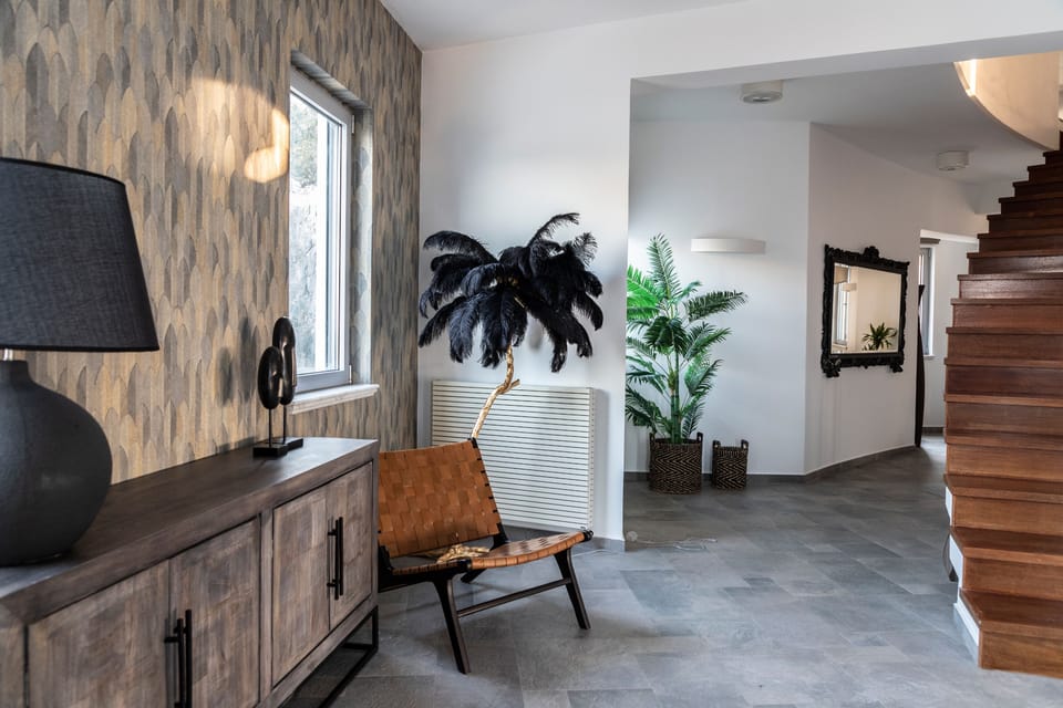 The stairs lead to the ground floor living cum area