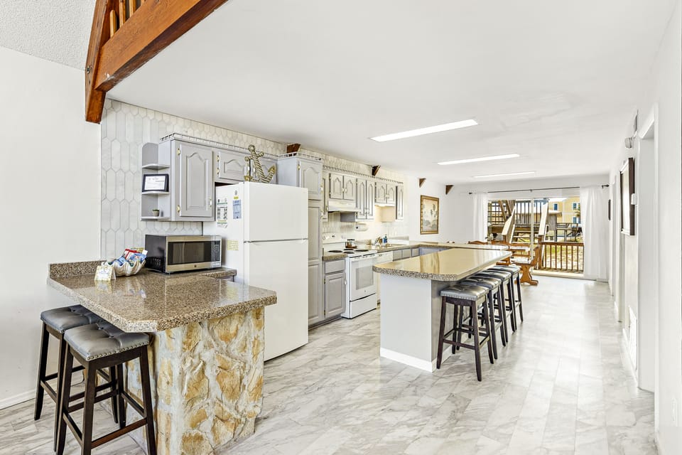 Walk ahead and enter into the open, fully-equipped kitchen, where you can cook in.