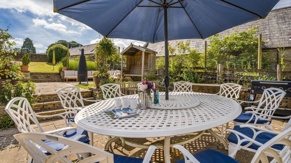 Dine al-fresco on the patio area featuring a BBQ.