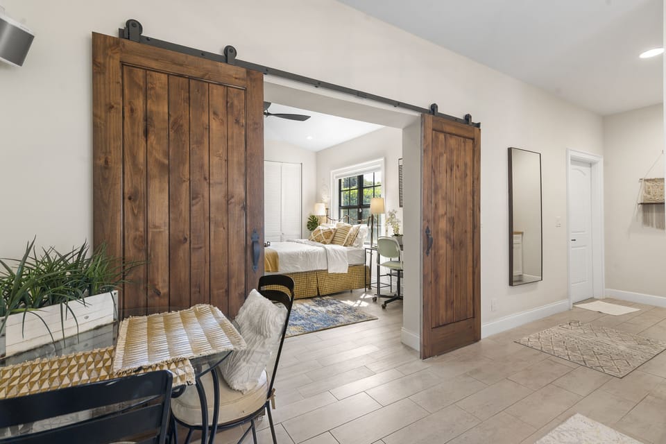 bedroom entrance is adorned with a sophisticated door. 