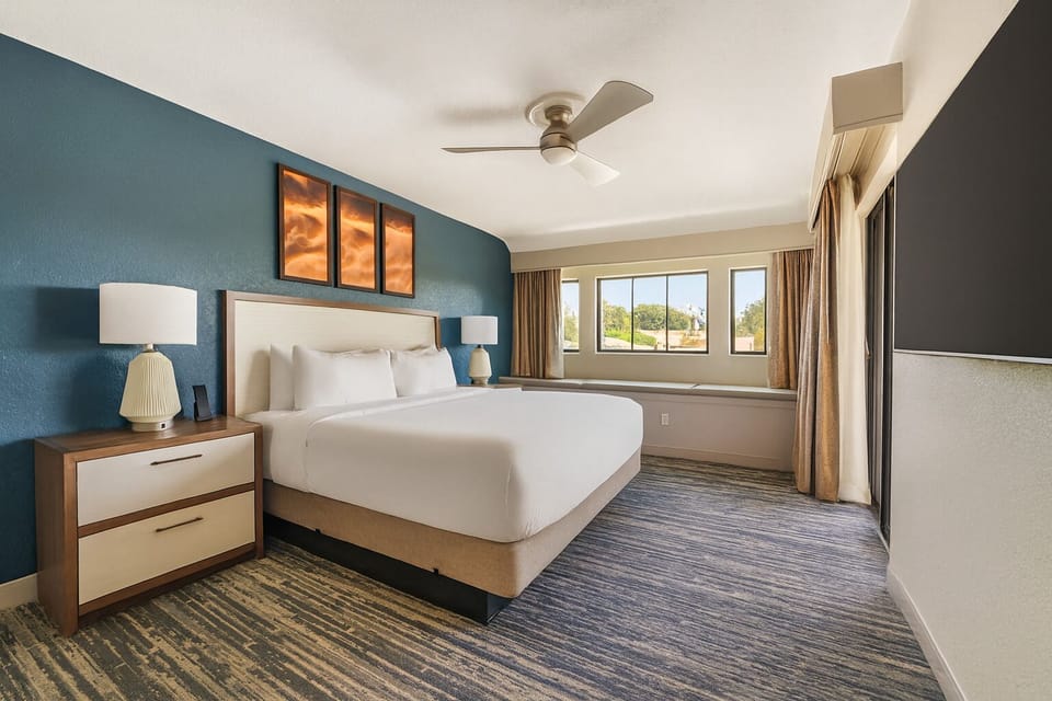 Unwind in a serene king bedroom with sunny views.