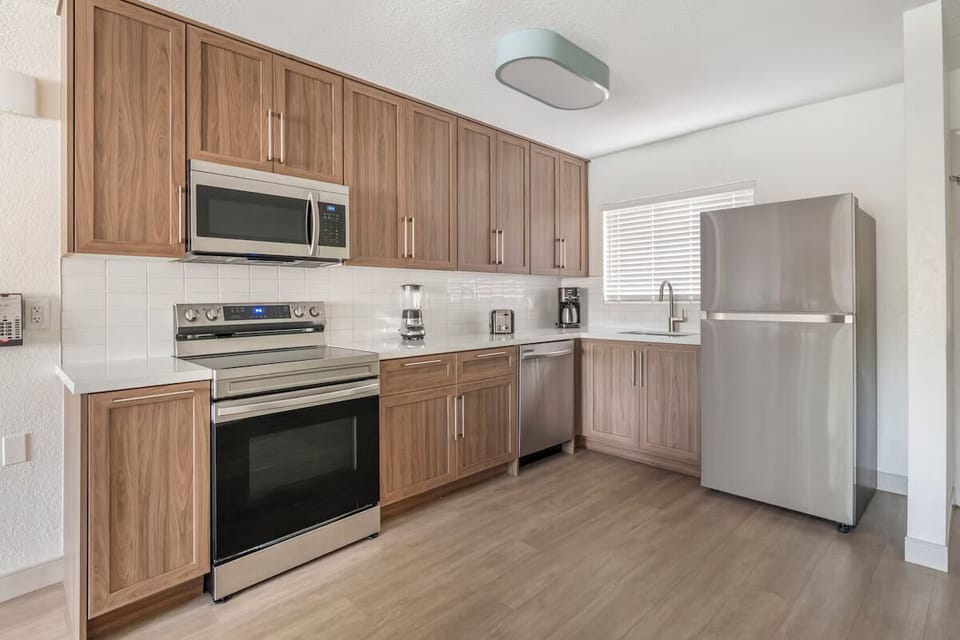 Cook easy meals in the full kitchen with stainless appliances.