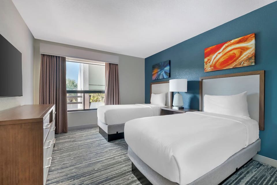 Settle into crisp double beds for effortless, restful sleep.