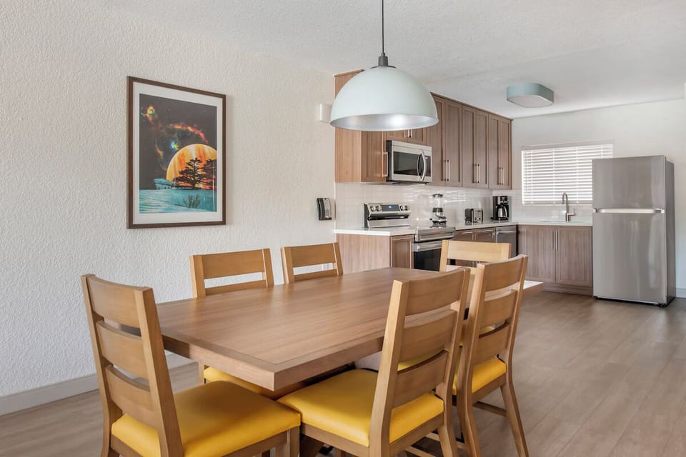 Gather for meals at the welcoming table in open-plan comfort.
