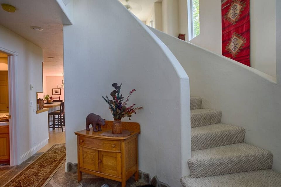 Entryway with stains to upper level