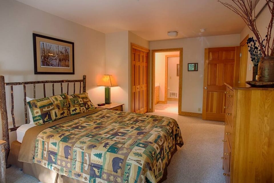 Master bedroom king bed and on-suite bathroom