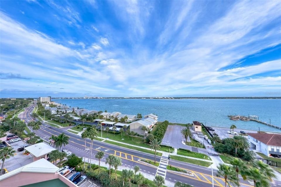 View of the tennis court and intercoastal water from the front d - View of the tennis court and intercoastal water from the front door of this condo.