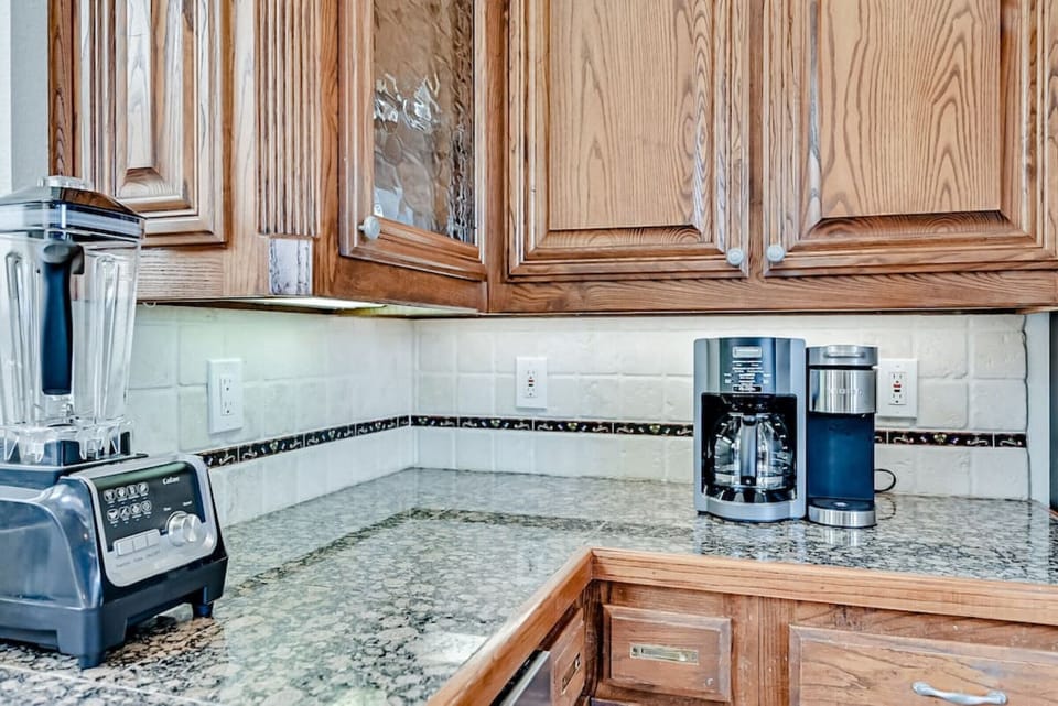 Blender, Keurig and carafe coffee maker in kitchen