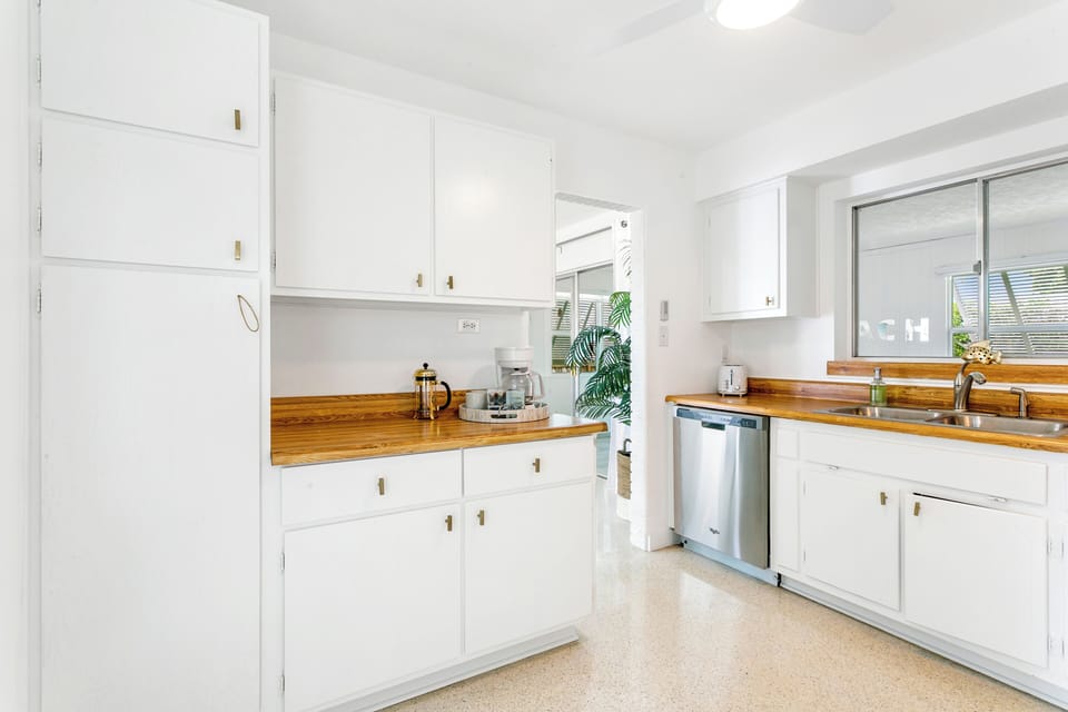 Original wood cabinets by the original owners have been refreshed