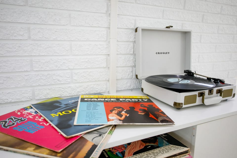 Vintage records and record player with bluetooth you can hook up your phone