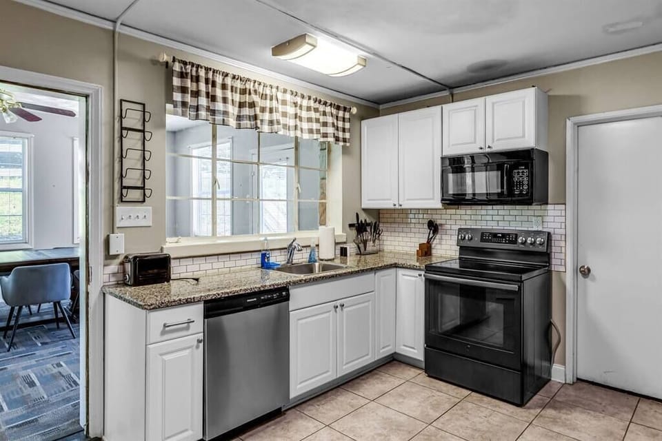 Full Kitchen With Pots, Pans, Plates, Cups, Utensils