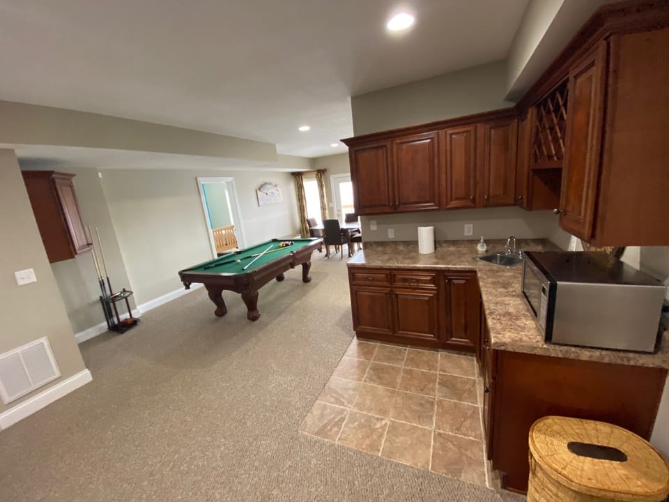 Downstairs pool table and wet bar w/ mini fridge 
