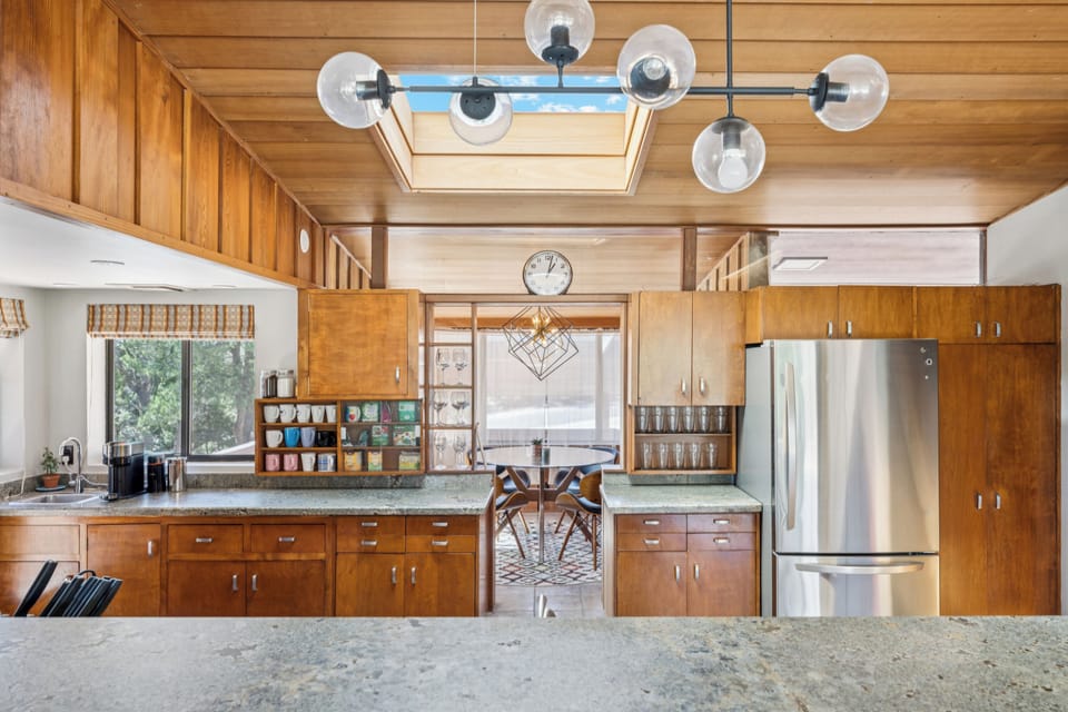 Gather for meals or games in the chic mid-century inspired dining space.