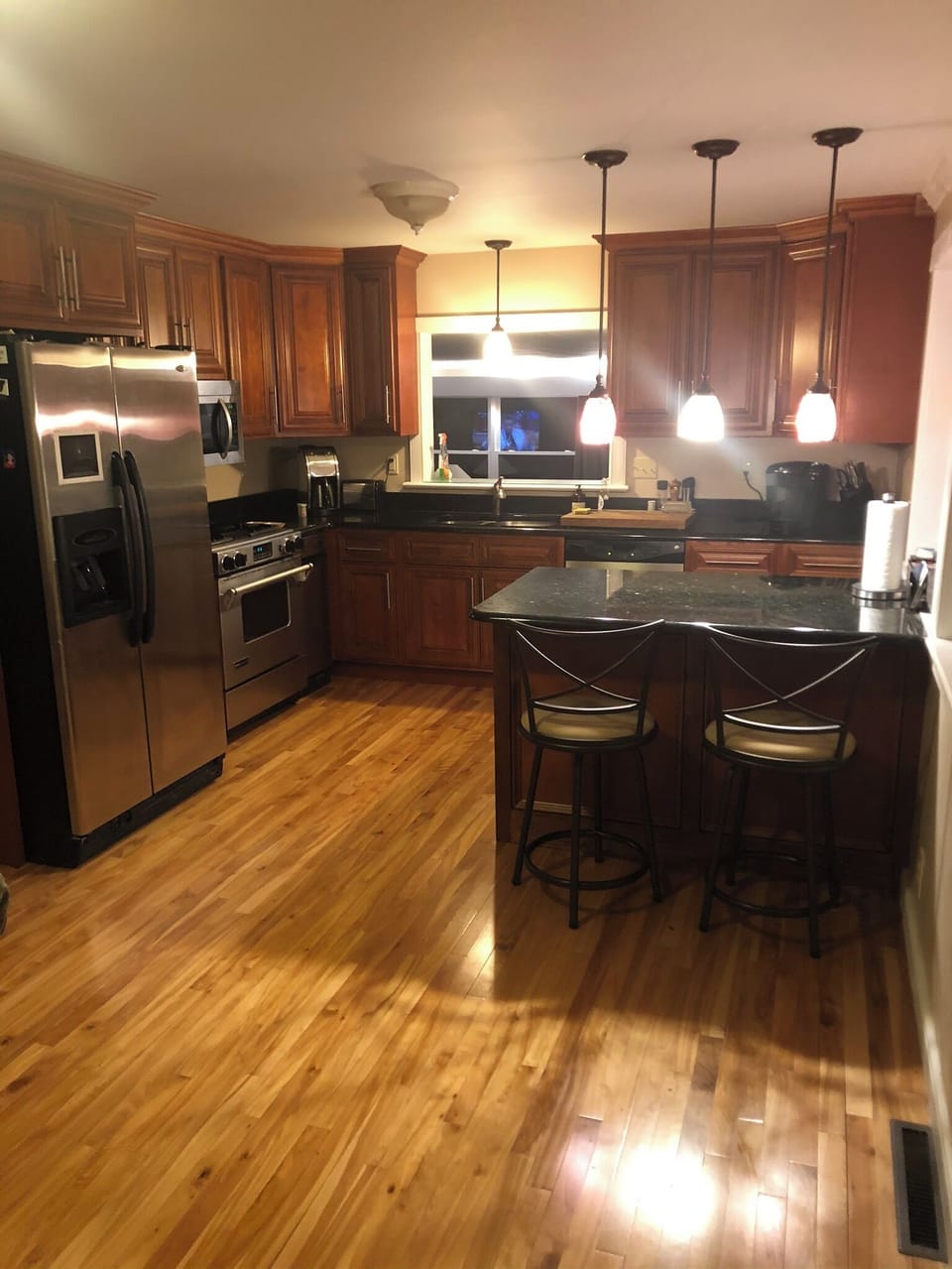 Kitchen with granite countertops and stainless appliances including dishwasher
