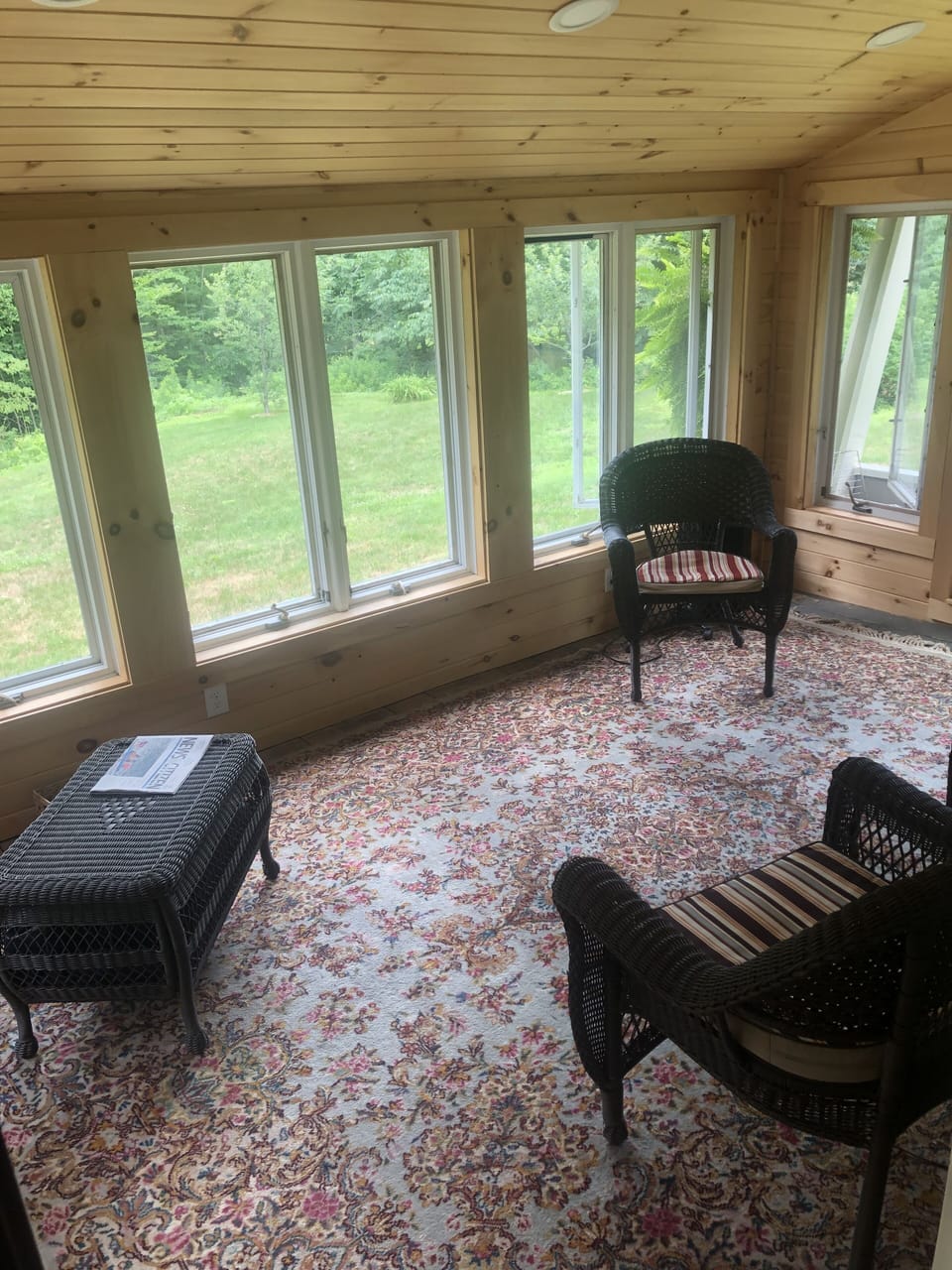 Large sunroom makes for a nice reading room or just a place to sip a cup of tea.