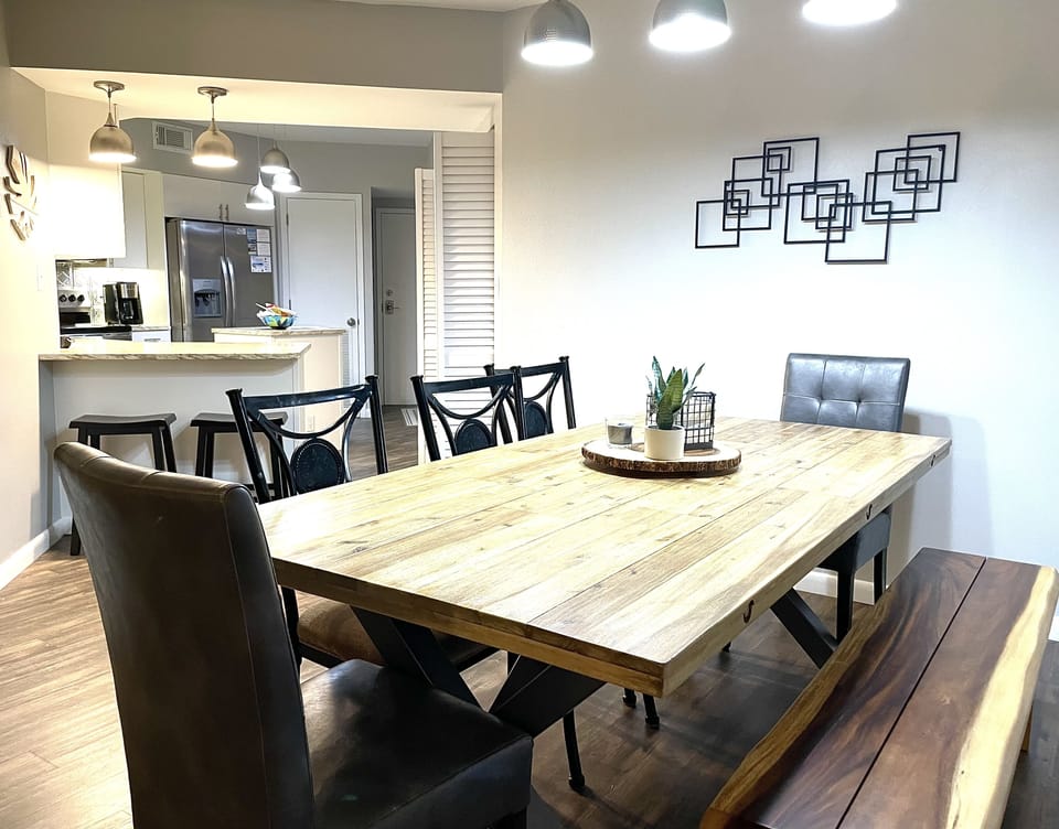 View from dining room into kitchen.  Two additional stools at counter.