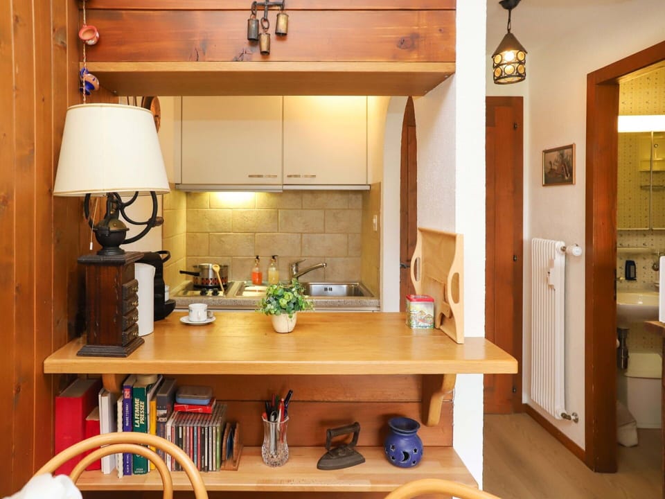Property, Furniture, Cabinetry, Table, Wood, Interior Design, Kitchen, Countertop, Living Room, Floor