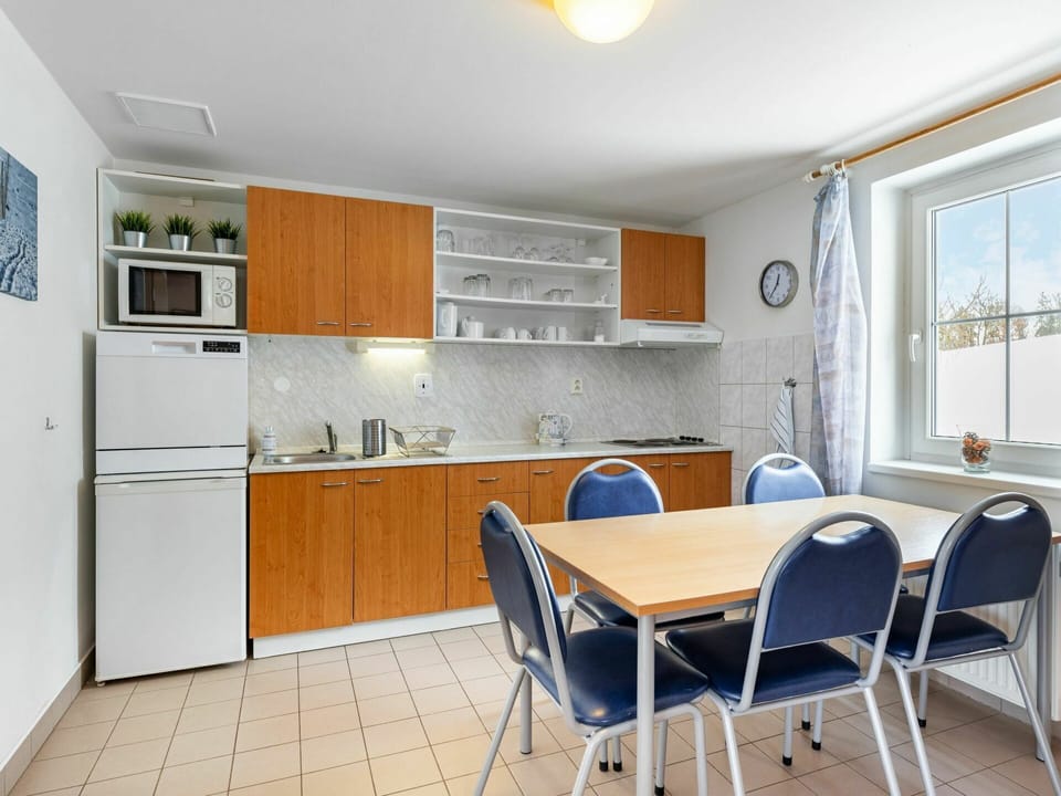 Furniture, Cabinetry, Property, Building, Countertop, Table, Chair, Wood, Lighting, Interior Design