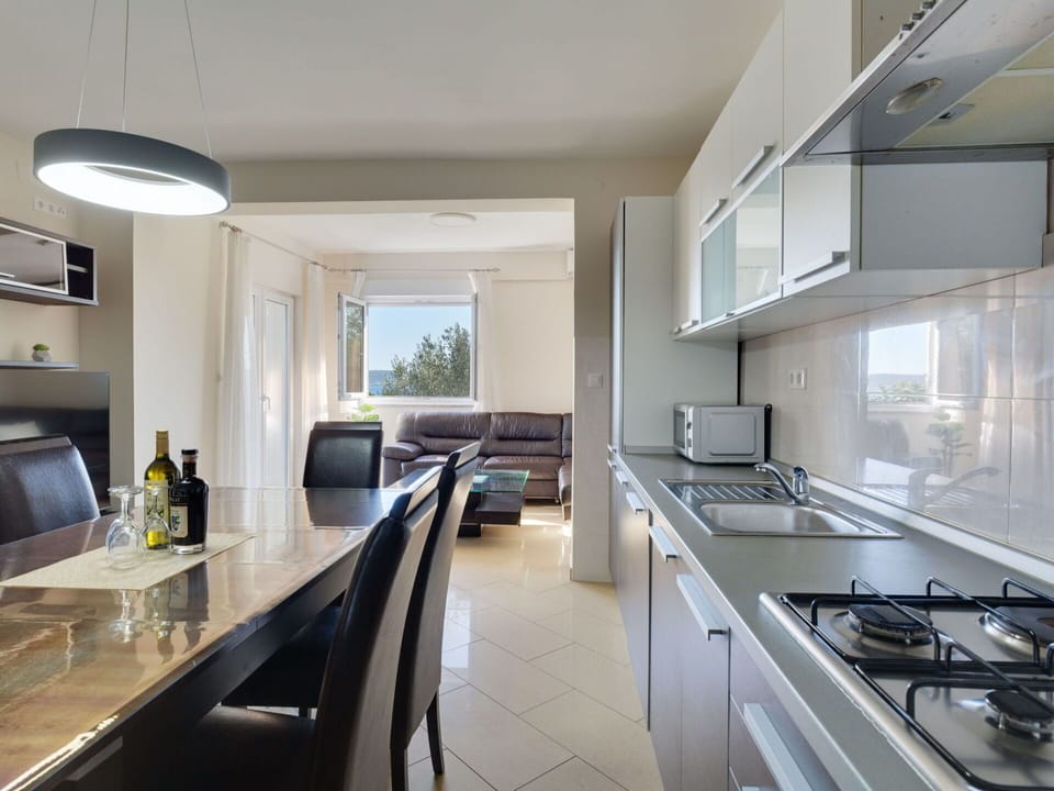 Cabinetry, Countertop, Furniture, Kitchen Appliance, Kitchen Sink, Kitchen, Kitchen Stove, Tap, Home Appliance, Wood