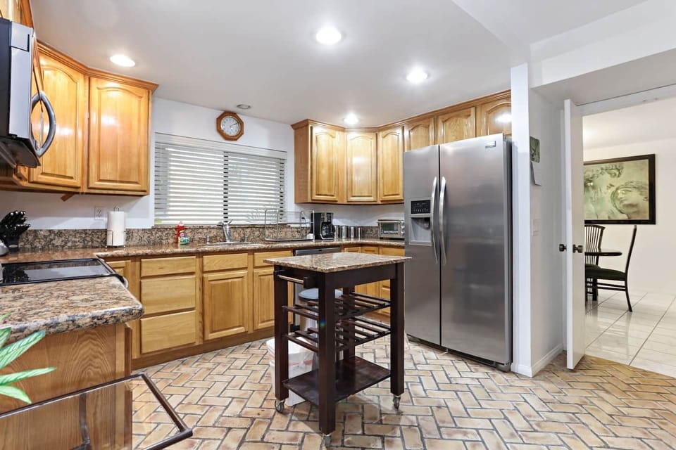 Updated kitchen with stainless steel appliances.