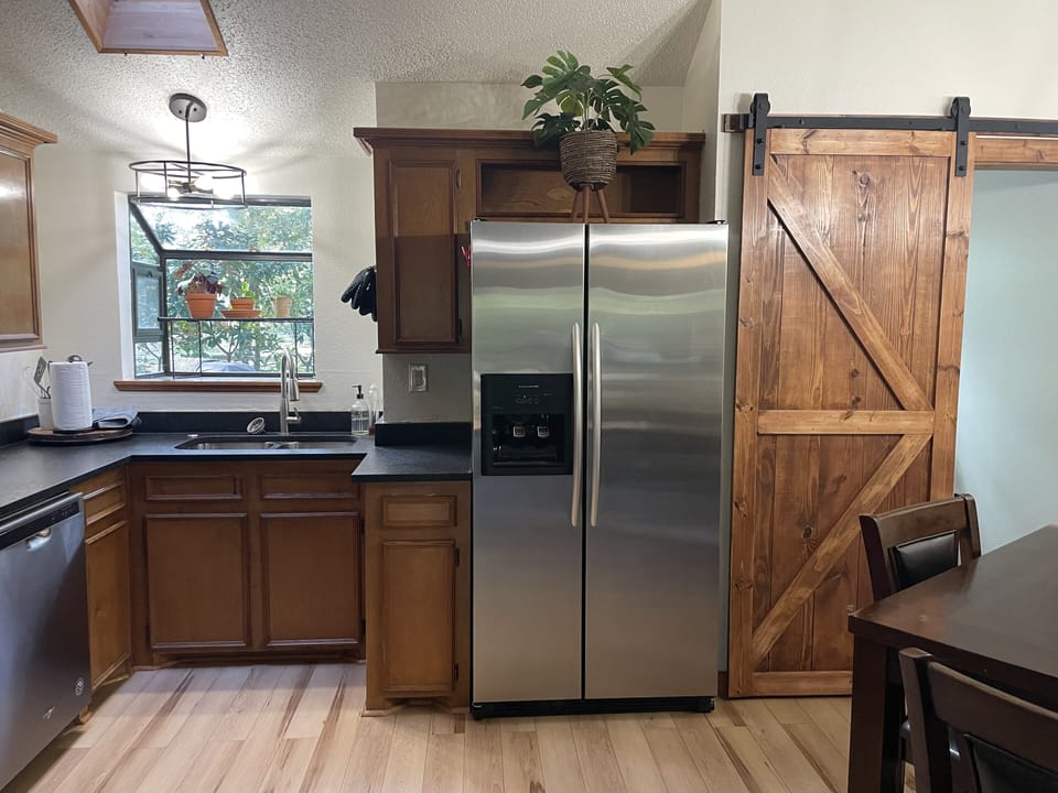 New Sink, Refrigerator and BarnDoor towards Laundry room 