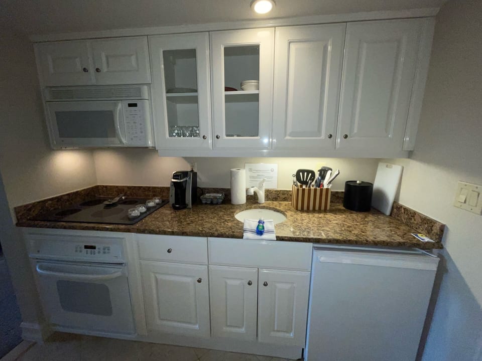Fully stocked kitchen w/ pots & pans. Small NEW fridge. Ice maker down the hall