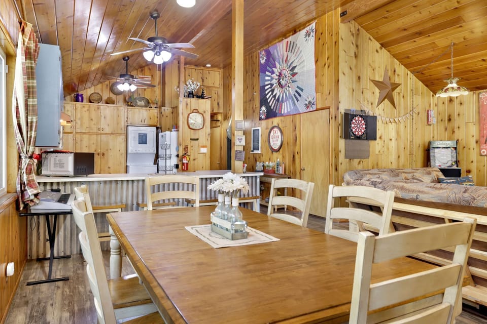 Spacious dining area with seating for six, inviting guests to gather for meals, conversations, and memorable experiences.