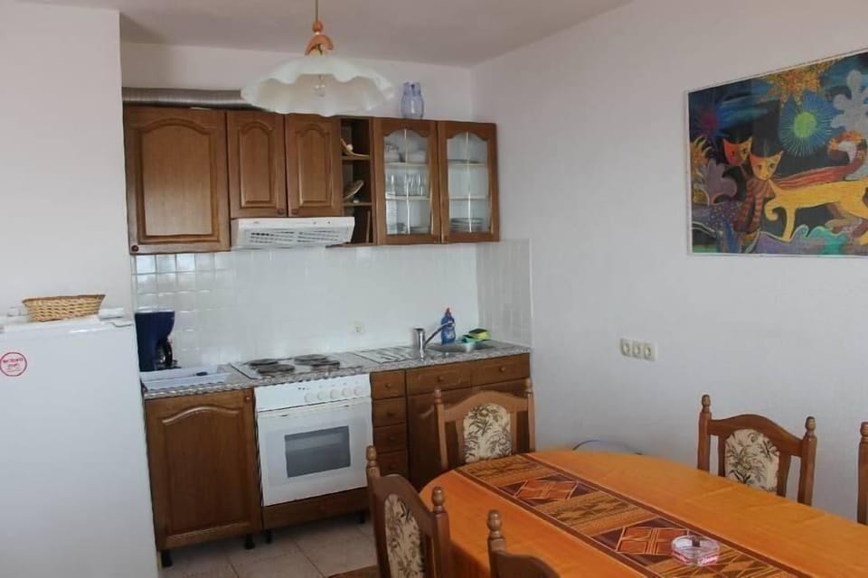 living room with kitchen and dining room
