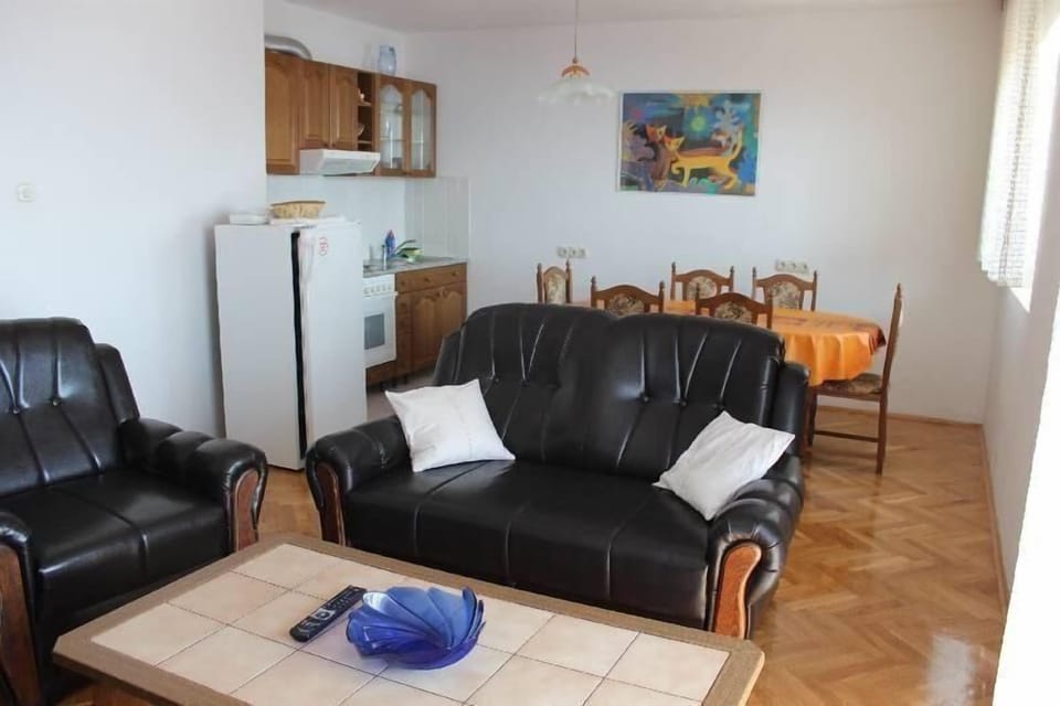 living room with kitchen and dining room