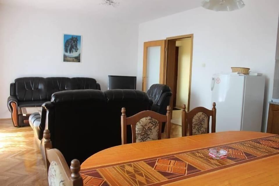living room with kitchen and dining room